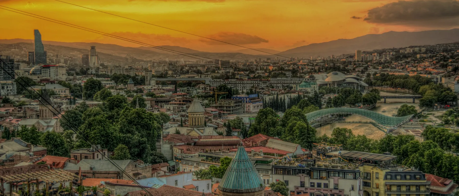 Tbilisi at sunset, looking across the old city toward the Bridge of Peace